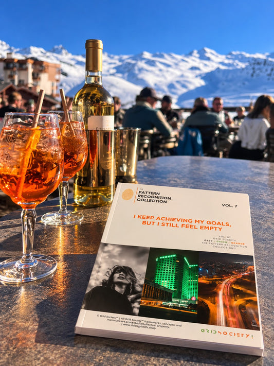 A book titled 'I KEEP ACHIEVING MY GOALS, BUT I STILL FEEL EMPTY' from the Pattern Breaker Collection Vol. 7 is displayed on a bar table in front of a mountain restaurant background.