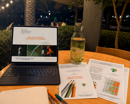 Pattern Recognition Workbook Vol. 1, I Feel Like I’m Behind Compared to My Friends, used on a laptop for evening reflections, self-reflection, inner work and journaling at an outdoor café in Dubai.